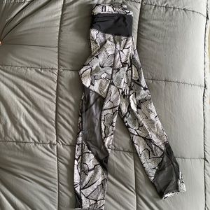 Lululemon:  mid rise, crop tights, mesh cutouts, side pockets.